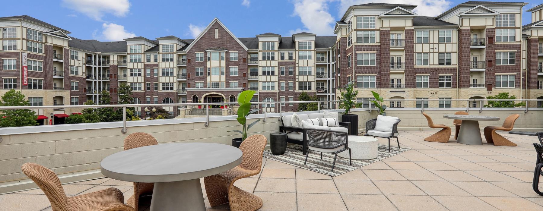 a courtyard with tables and chairs